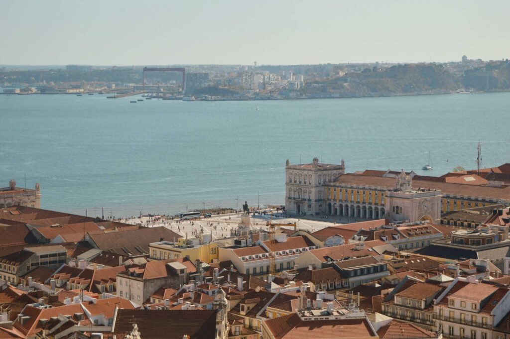 View of Lisbon rooftops and sea. 