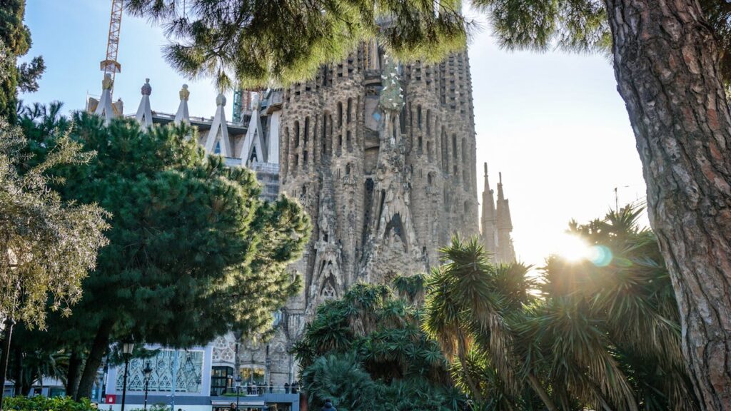 barcelona's cathedral peeking through the sun