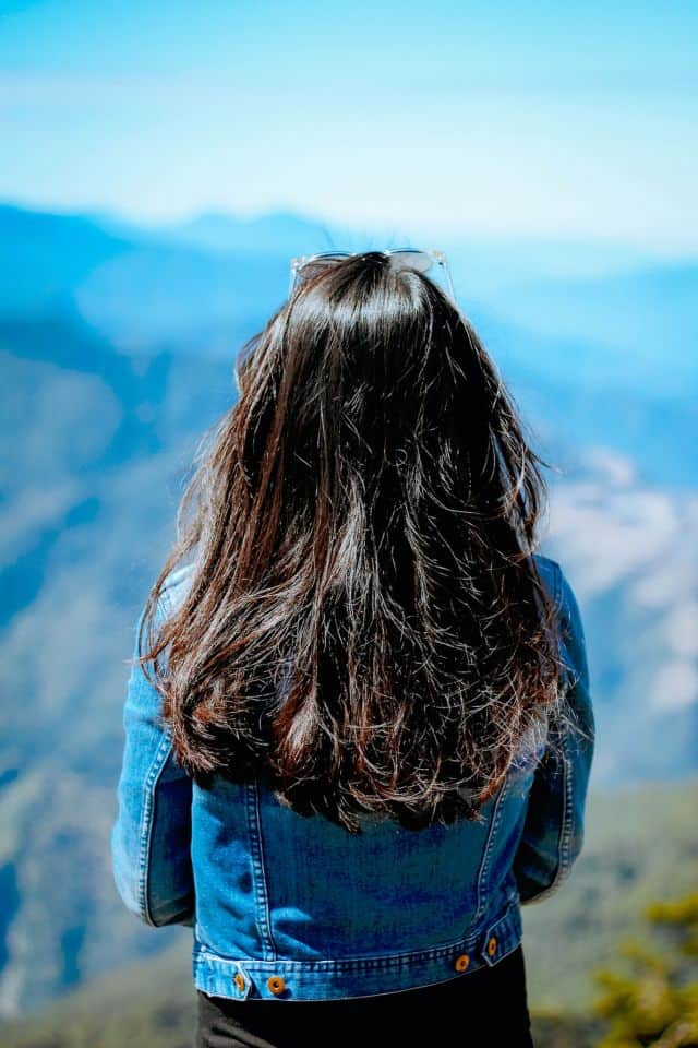 women looking away with long dark hair