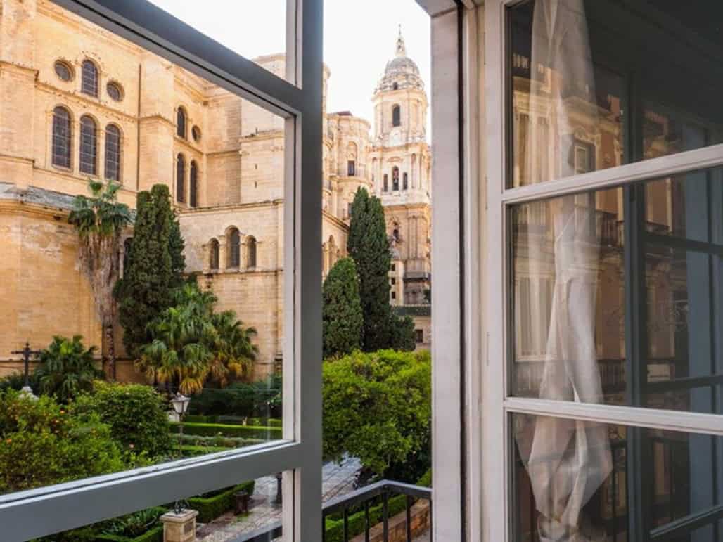 room with a window view of a cathedral 