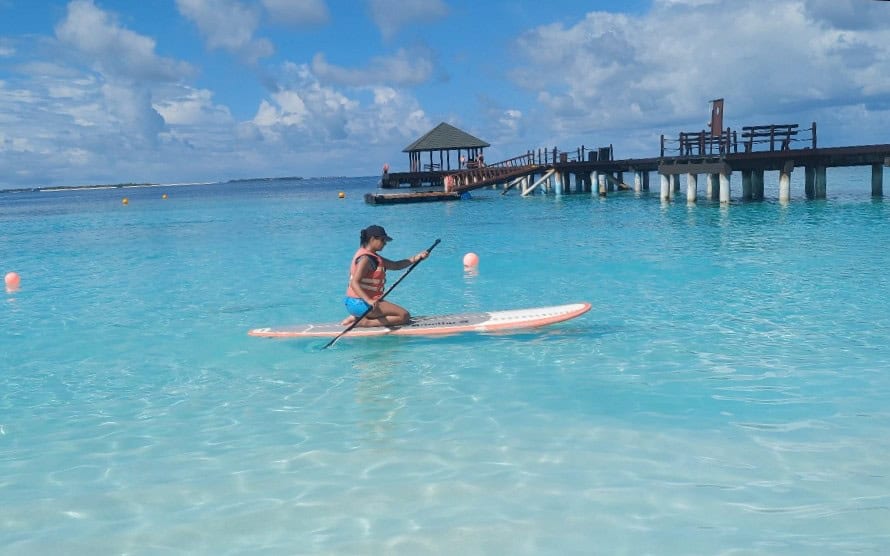 girl sitting on a paddleboard